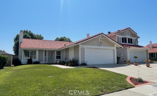 27896 Beacon St, Castaic, CA 91384 - view of front of property featuring a tiled roof, driveway, a front lawn, and an attached garage