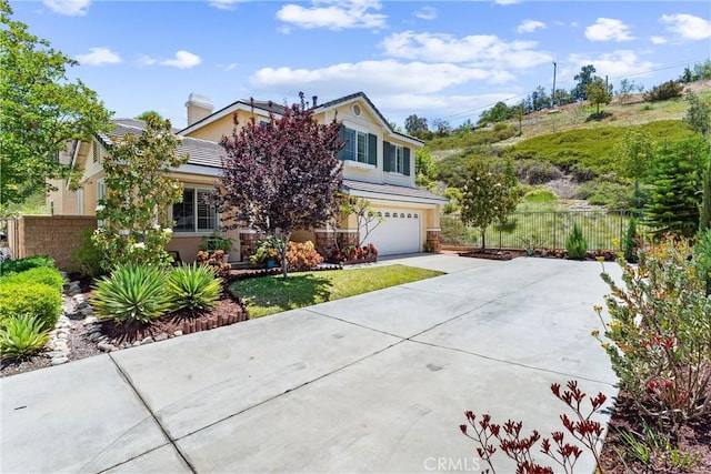 35694 Cherry Bark Way, Murrieta, CA 92562 - view of property hidden behind natural elements with an attached garage, concrete driveway, and stucco siding