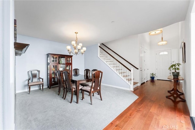 35694 Cherry Bark Way, Murrieta, CA 92562 - dining area featuring a chandelier, stairway, and light wood-style floors