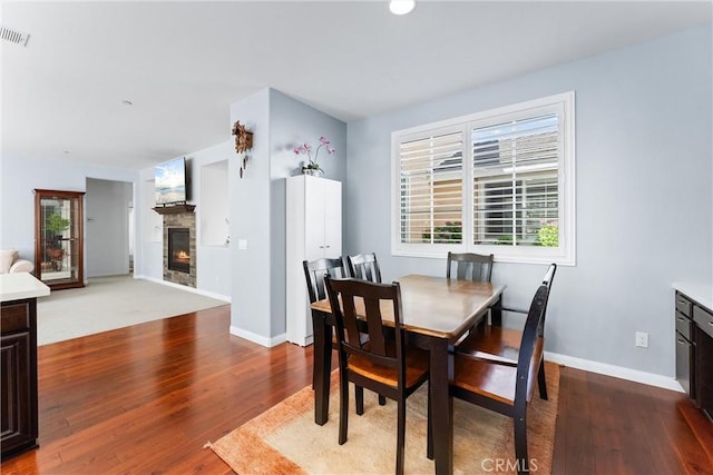 35694 Cherry Bark Way, Murrieta, CA 92562 - dining area featuring a fireplace and wood finished floors