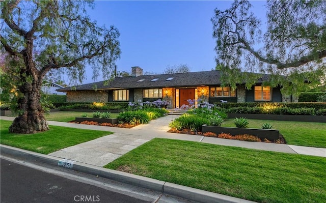 1251 Bryant Rd, Long Beach, CA 90815 - single story home featuring a front yard, a chimney, and stone siding