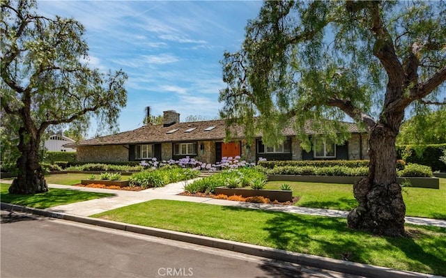 1251 Bryant Rd, Long Beach, CA 90815 - single story home featuring a chimney, a front yard, and stone siding