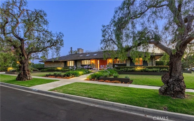 1251 Bryant Rd, Long Beach, CA 90815 - ranch-style home with a front lawn and a chimney