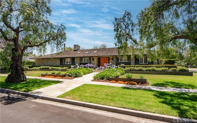 1251 Bryant Rd, Long Beach, CA 90815 - single story home with a chimney, a front lawn, and stone siding
