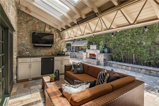1251 Bryant Rd, Long Beach, CA 90815 - view of patio / terrace featuring an outdoor living space with a fireplace and exterior kitchen