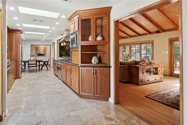 1251 Bryant Rd, Long Beach, CA 90815 - bar with a skylight, appliances with stainless steel finishes, stone tile floors, recessed lighting, and wood ceiling