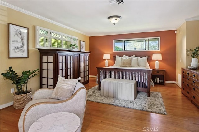 1251 Bryant Rd, Long Beach, CA 90815 - bedroom with ornamental molding, multiple windows, and wood finished floors