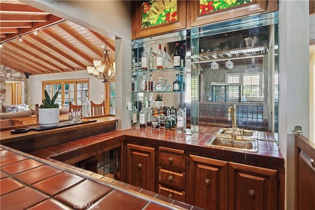 1251 Bryant Rd, Long Beach, CA 90815 - indoor wet bar with wooden ceiling and a chandelier