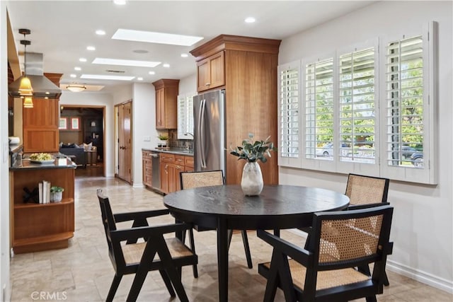 1251 Bryant Rd, Long Beach, CA 90815 - dining area with recessed lighting and a skylight