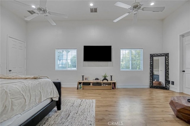 8140 Quartz Ave, Winnetka, CA 91306 - bedroom with multiple windows, wood finished floors, recessed lighting, ceiling fan, and vaulted ceiling