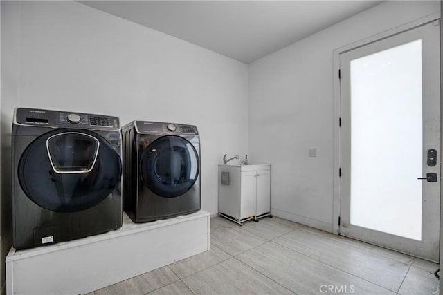 8140 Quartz Ave, Winnetka, CA 91306 - laundry room with washer and dryer, cabinet space, and tile patterned floors