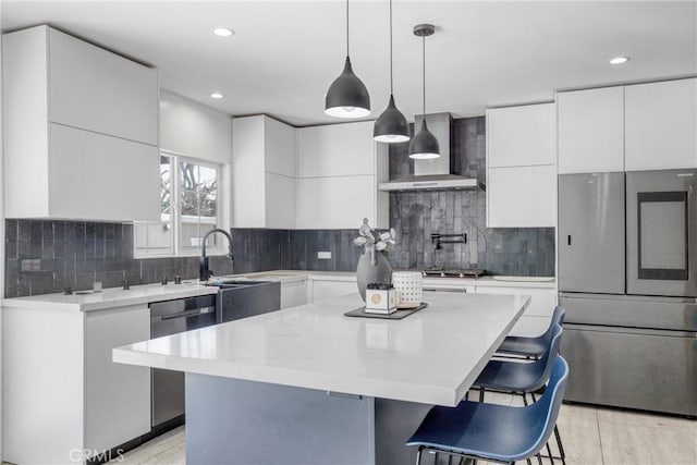 8140 Quartz Ave, Winnetka, CA 91306 - kitchen featuring stainless steel appliances, wall chimney exhaust hood, modern cabinets, white cabinets, and recessed lighting