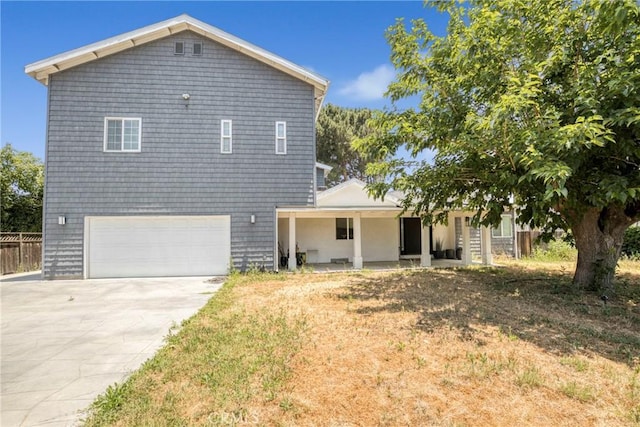 8140 Quartz Ave, Winnetka, CA 91306 - view of front facade featuring a garage, concrete driveway, and a porch
