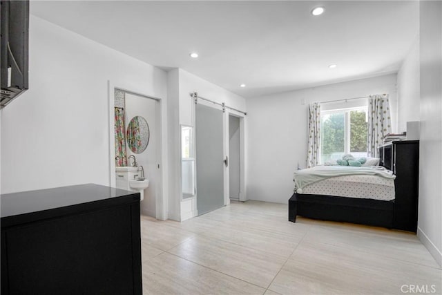 8140 Quartz Ave, Winnetka, CA 91306 - bedroom with a barn door and recessed lighting