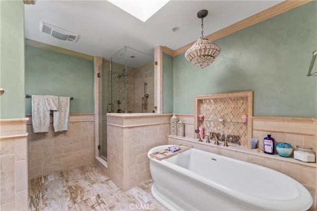 34037 Agua Dulce Canyon Rd, Agua Dulce, CA 91390 - full bathroom featuring tile walls, a stall shower, a soaking tub, a wainscoted wall, and ornamental molding