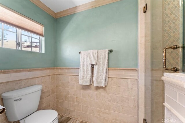 34037 Agua Dulce Canyon Rd, Agua Dulce, CA 91390 - bathroom featuring tile walls, wainscoting, and tiled shower