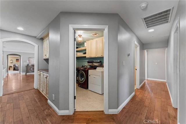 34037 Agua Dulce Canyon Rd, Agua Dulce, CA 91390 - hallway with washer and clothes dryer, wood-type flooring, arched walkways, and recessed lighting
