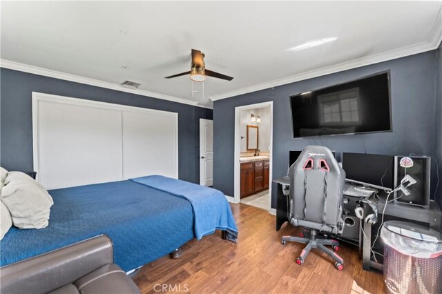 34037 Agua Dulce Canyon Rd, Agua Dulce, CA 91390 - bedroom with wood finished floors, ornamental molding, a closet, ensuite bath, and a ceiling fan