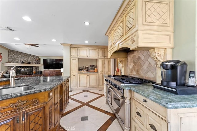 34037 Agua Dulce Canyon Rd, Agua Dulce, CA 91390 - kitchen featuring double oven range, cream cabinetry, decorative backsplash, open floor plan, and ceiling fan