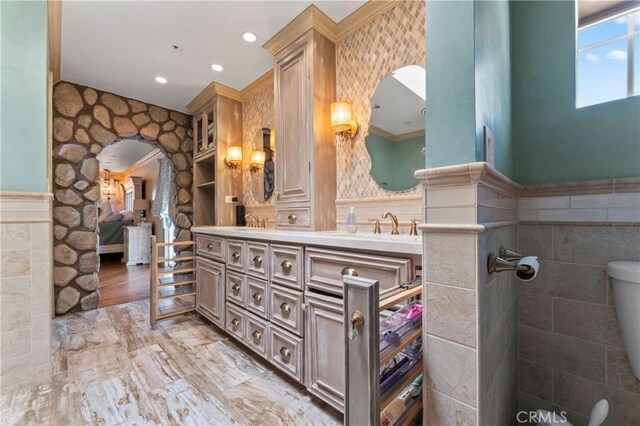 34037 Agua Dulce Canyon Rd, Agua Dulce, CA 91390 - ensuite bathroom featuring wainscoting, double vanity, tile walls, and recessed lighting