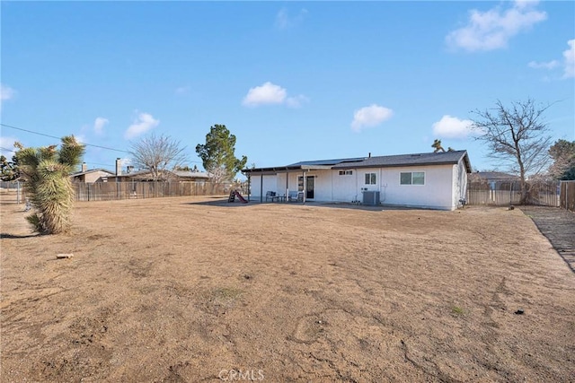 12684 Snapping Turtle Rd, Apple Valley, CA 92308 - back of house featuring a patio area, solar panels, and a fenced backyard