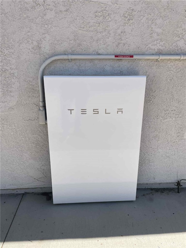 12684 Snapping Turtle Rd, Apple Valley, CA 92308 - exterior view of wall-mounted power storage and stucco siding