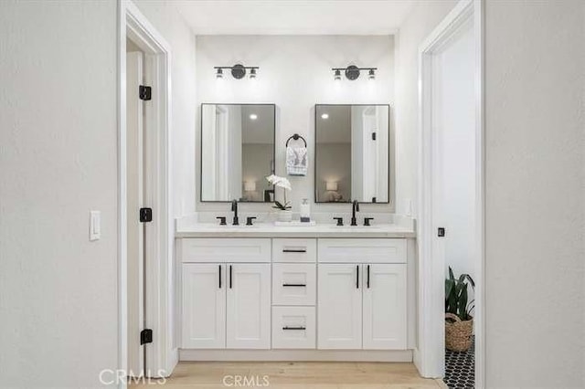 6212 Sacramento Ave, Rancho Cucamonga, CA 91701 - full bathroom with double vanity and wood finished floors