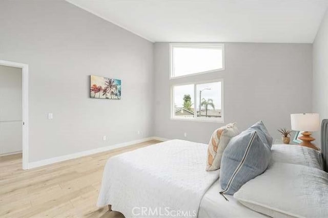 6212 Sacramento Ave, Rancho Cucamonga, CA 91701 - bedroom featuring light wood-style flooring and lofted ceiling
