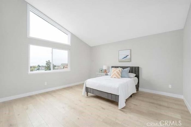 6212 Sacramento Ave, Rancho Cucamonga, CA 91701 - bedroom with vaulted ceiling and light wood finished floors