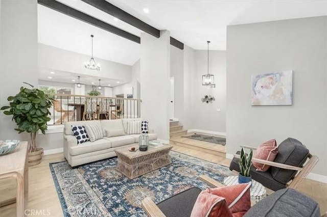 6212 Sacramento Ave, Rancho Cucamonga, CA 91701 - living room with a chandelier, wood finished floors, beam ceiling, and high vaulted ceiling