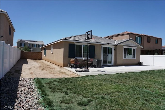 27082 Nolana Way, Menifee, CA 92584 - rear view of property featuring a fenced backyard, a patio, stucco siding, and a tiled roof