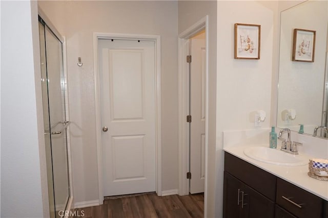 27082 Nolana Way, Menifee, CA 92584 - bathroom featuring vanity, wood finished floors, and an enclosed shower