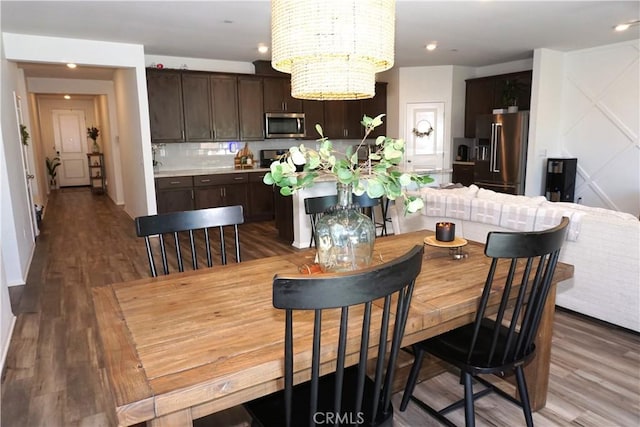 27082 Nolana Way, Menifee, CA 92584 - dining room with a chandelier, wood finished floors, and recessed lighting
