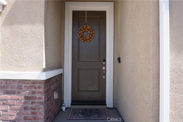 27082 Nolana Way, Menifee, CA 92584 - property entrance with stucco siding and brick siding