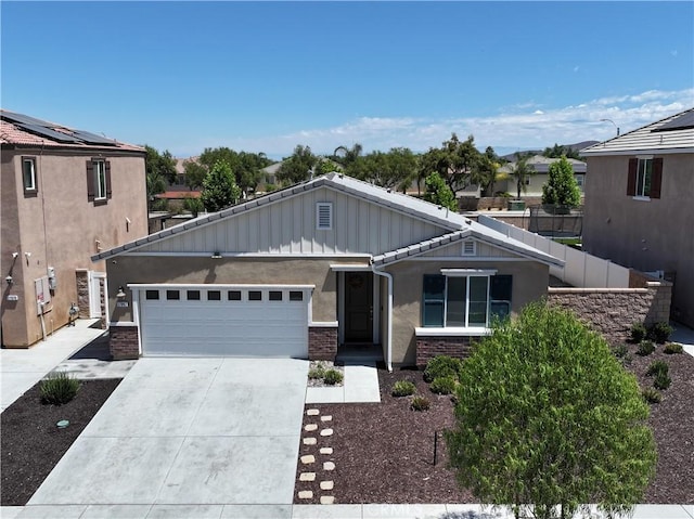 27082 Nolana Way, Menifee, CA 92584 - view of front of home featuring stucco siding, an attached garage, driveway, and board and batten siding