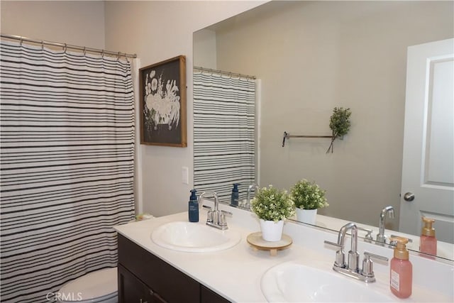27082 Nolana Way, Menifee, CA 92584 - bathroom featuring double vanity and a shower with shower curtain