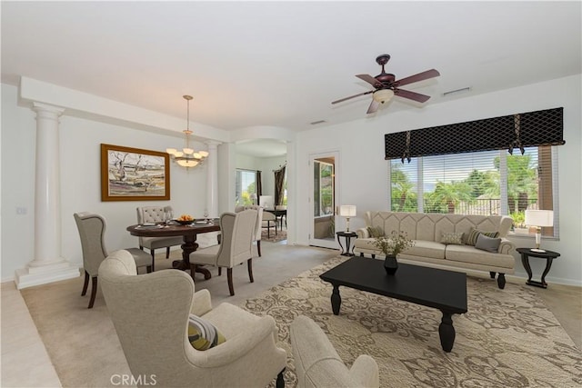 24038 Watercress Dr, Corona, CA 92883 - living area featuring ornate columns, ceiling fan, arched walkways, and a chandelier