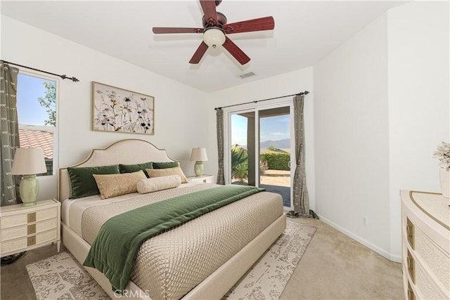 24038 Watercress Dr, Corona, CA 92883 - bedroom with access to exterior, multiple windows, a ceiling fan, and light carpet