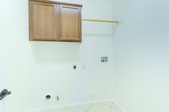 24038 Watercress Dr, Corona, CA 92883 - washroom featuring hookup for a gas dryer, hookup for a washing machine, hookup for an electric dryer, cabinet space, and light tile patterned floors