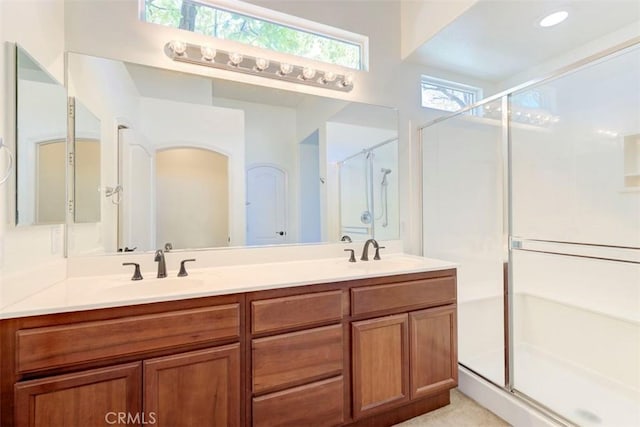 24038 Watercress Dr, Corona, CA 92883 - bathroom with a shower stall, healthy amount of natural light, and double vanity