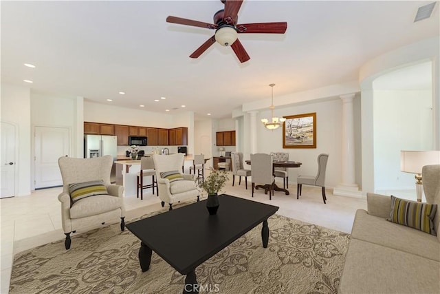 24038 Watercress Dr, Corona, CA 92883 - living room with ornate columns, ceiling fan, recessed lighting, and a chandelier