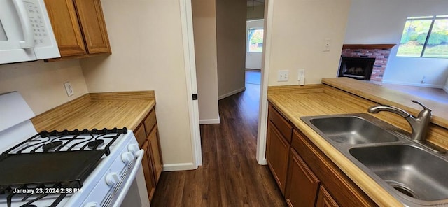3040 Charwood Ct, Spring Valley, CA 91977 - kitchen featuring white appliances, brown cabinetry, dark wood finished floors, and light countertops