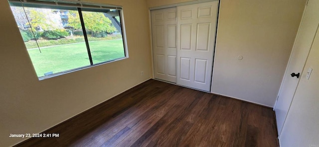 3040 Charwood Ct, Spring Valley, CA 91977 - unfurnished bedroom with a closet and dark wood finished floors