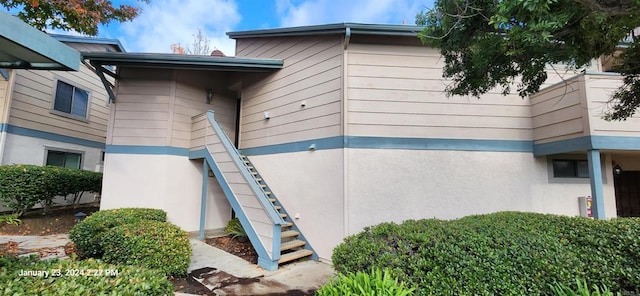3040 Charwood Ct, Spring Valley, CA 91977 - view of side of home with stairs and stucco siding