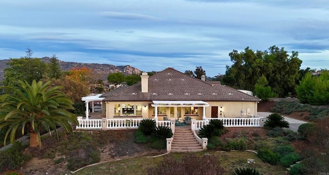3017 Rue Montreux, Escondido, CA 92026 - back of house featuring a chimney, stucco siding, stairs, a porch, and a tile roof