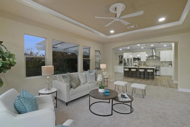 3017 Rue Montreux, Escondido, CA 92026 - living room featuring crown molding, recessed lighting, ceiling fan, a tray ceiling, and light wood finished floors