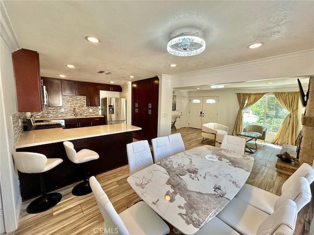 24252 Palmek Cir, Lake Forest, CA 92630 - dining space featuring ornamental molding, recessed lighting, and light wood-type flooring