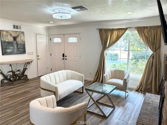 24252 Palmek Cir, Lake Forest, CA 92630 - living room featuring a textured ceiling, ornamental molding, and wood finished floors