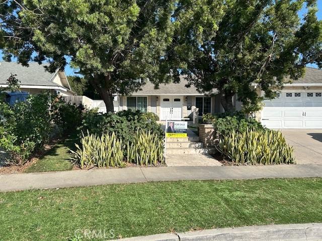 24252 Palmek Cir, Lake Forest, CA 92630 - obstructed view of property with an attached garage and driveway