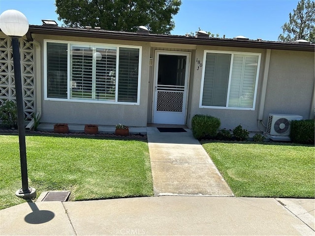 13361 N Fairfield Unit 180J, Seal Beach, CA 90740 - view of front of house with a front lawn and stucco siding